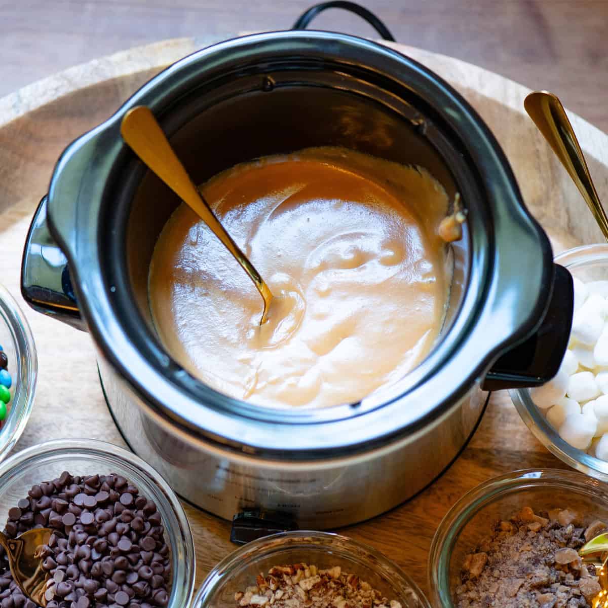 Close-up view of smooth and creamy caramel dip in a warmer