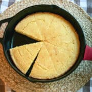 Close-up of a moist slice of cornbread showing texture and golden crust