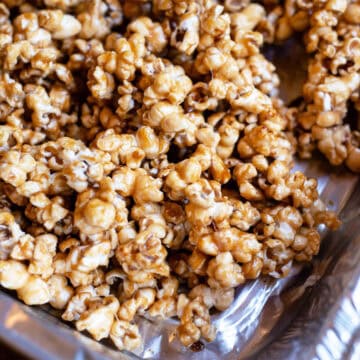 Close-up of caramel corn highlighting the glossy, crunchy caramel coating.