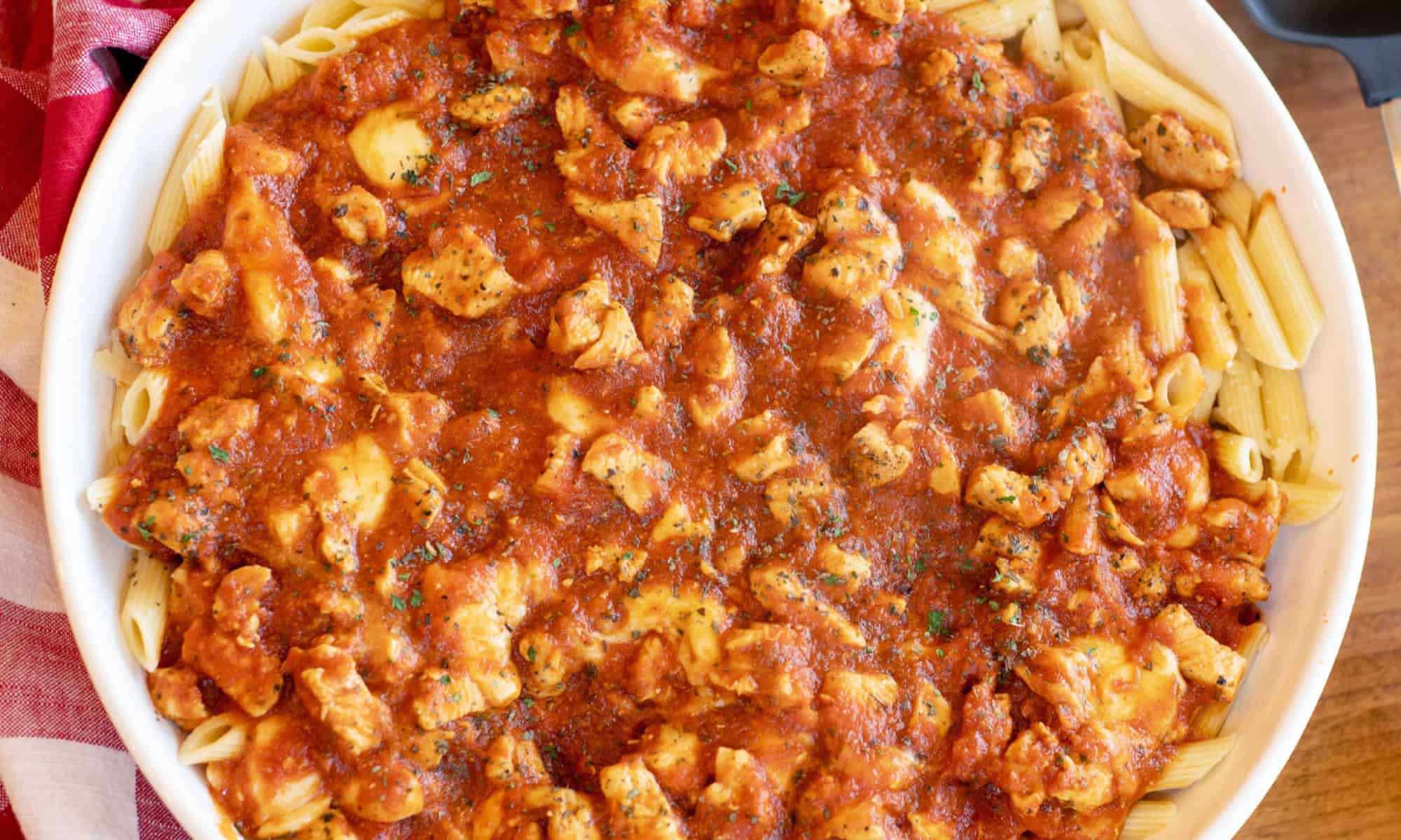 Chicken Mozzarella Pasta in a white bowl round up size