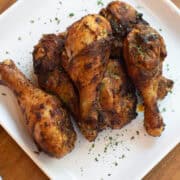 Close-up of crispy air fryer chicken drumsticks showing golden, seasoned skin and juicy texture