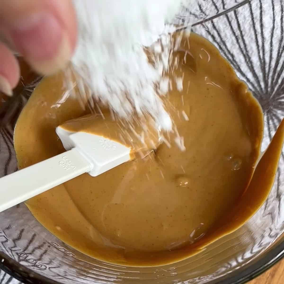 mixing the peanut butter and powdered sugar until smooth