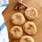 Freshly baked snickerdoodle cookies laid out on a tray ready to serve.
