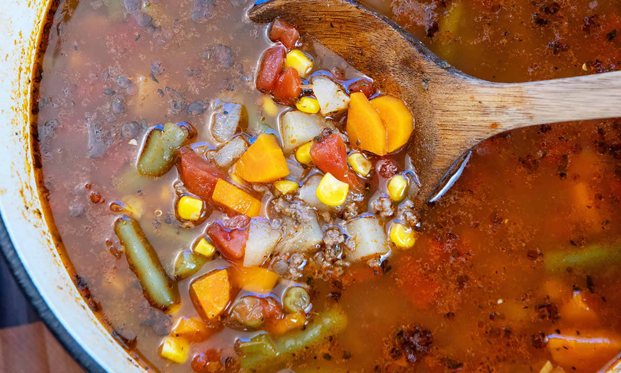 Zoomed in Beef vegetable Soup on spoon round up size
