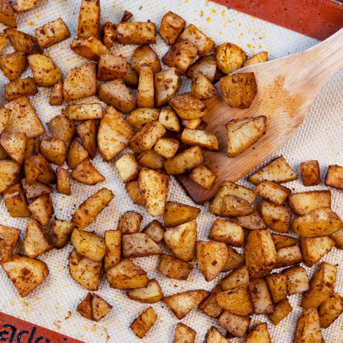 Spicy roasted potatoes on a sheet panswith spices, perfect as a side dish for breakfast, chicken, or steak