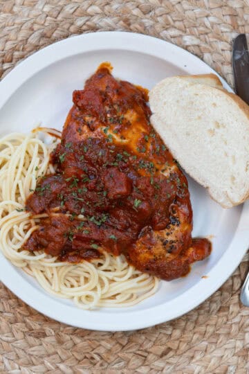 Hearty 30-minute weeknight dinner served pasta and fresh herbs on top.