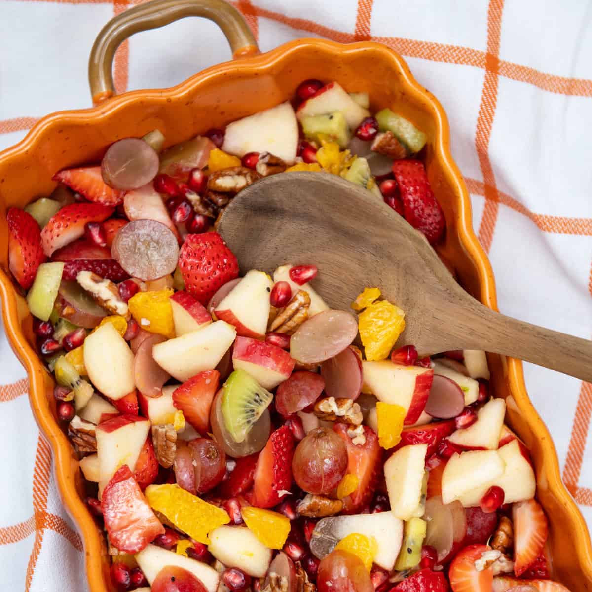 Festive bowl filled with colorful holiday fruit salad