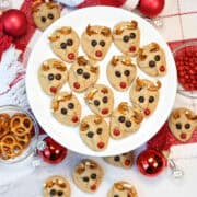 Peanut Butter reindeer Cookies close up on white plate with ornaments