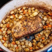 Pork Loin with Potatoes and Carrots in dutch oven pot ready to serve