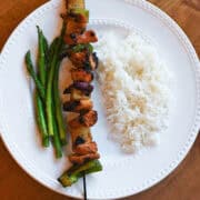 Grilled Hawaiian chicken kabobs with pineapple, bell peppers, and onions on skewers