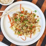 Close-up of Egg Roll in a Bowl highlighting seasoned ground turkey, shredded cabbage, and carrots with a savory glaze.