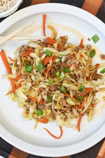 Close-up of Egg Roll in a Bowl highlighting seasoned ground turkey, shredded cabbage, and carrots with a savory glaze.