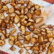 Spicy roasted potatoes on a sheet panswith spices, perfect as a side dish for breakfast, chicken, or steak