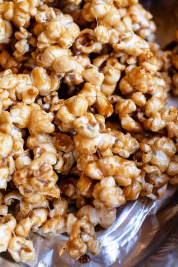 Close-up of golden caramel popcorn with a glossy, crunchy coating