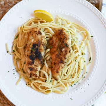 Chicken Scampi served simply on a white plate, highlighting the vibrant colors and textures.