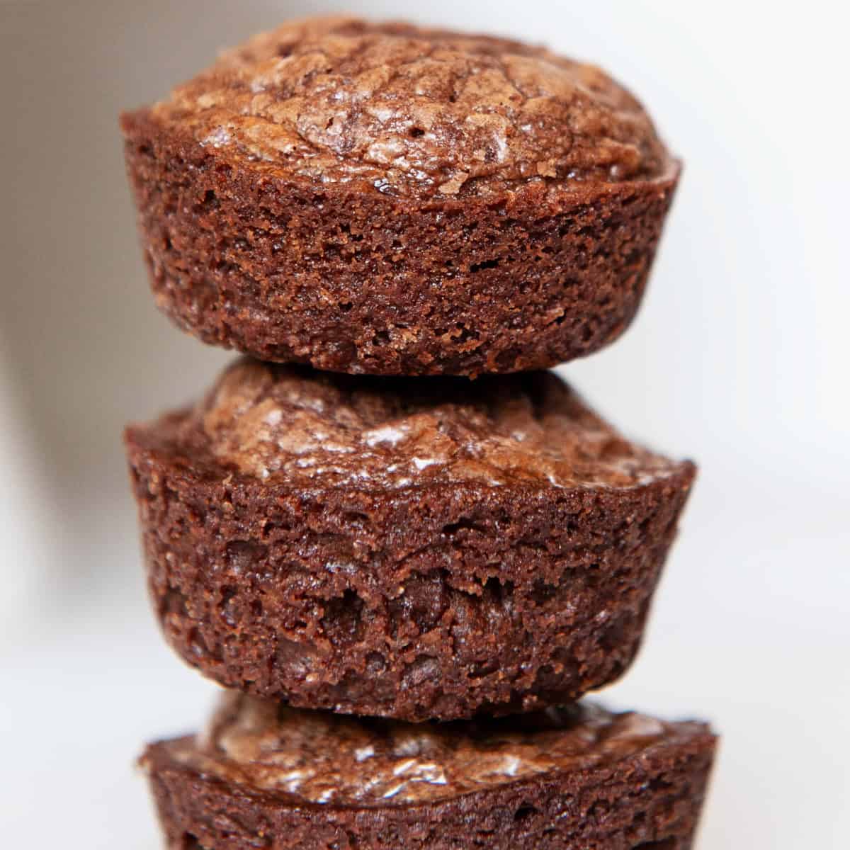 Close-up of stacked mini brownie bites showing a rich, fudgy texture and gooey chocolate center