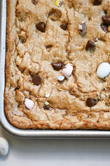 Close-up of corner piece of Cadbury Egg cookie bar showing crisp edges and soft center.