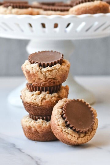 Stack of peanut butter cup cookies showing the chocolate peanut butter cup centers.