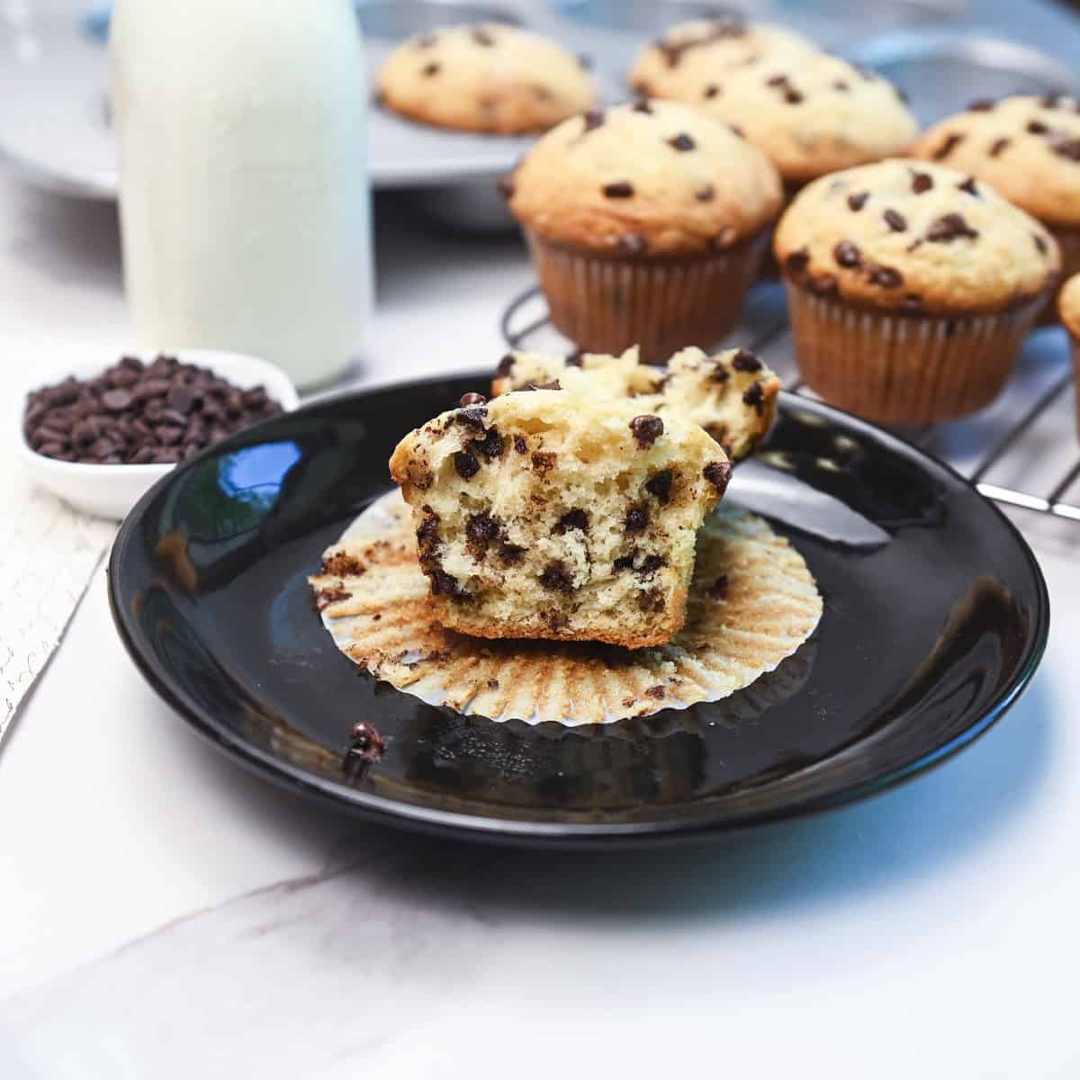 Close-up of a halved chocolate chip muffin showing soft and fluffy interior