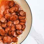 BBQ Sausages in cream skillet ready to serve with no toothpicks