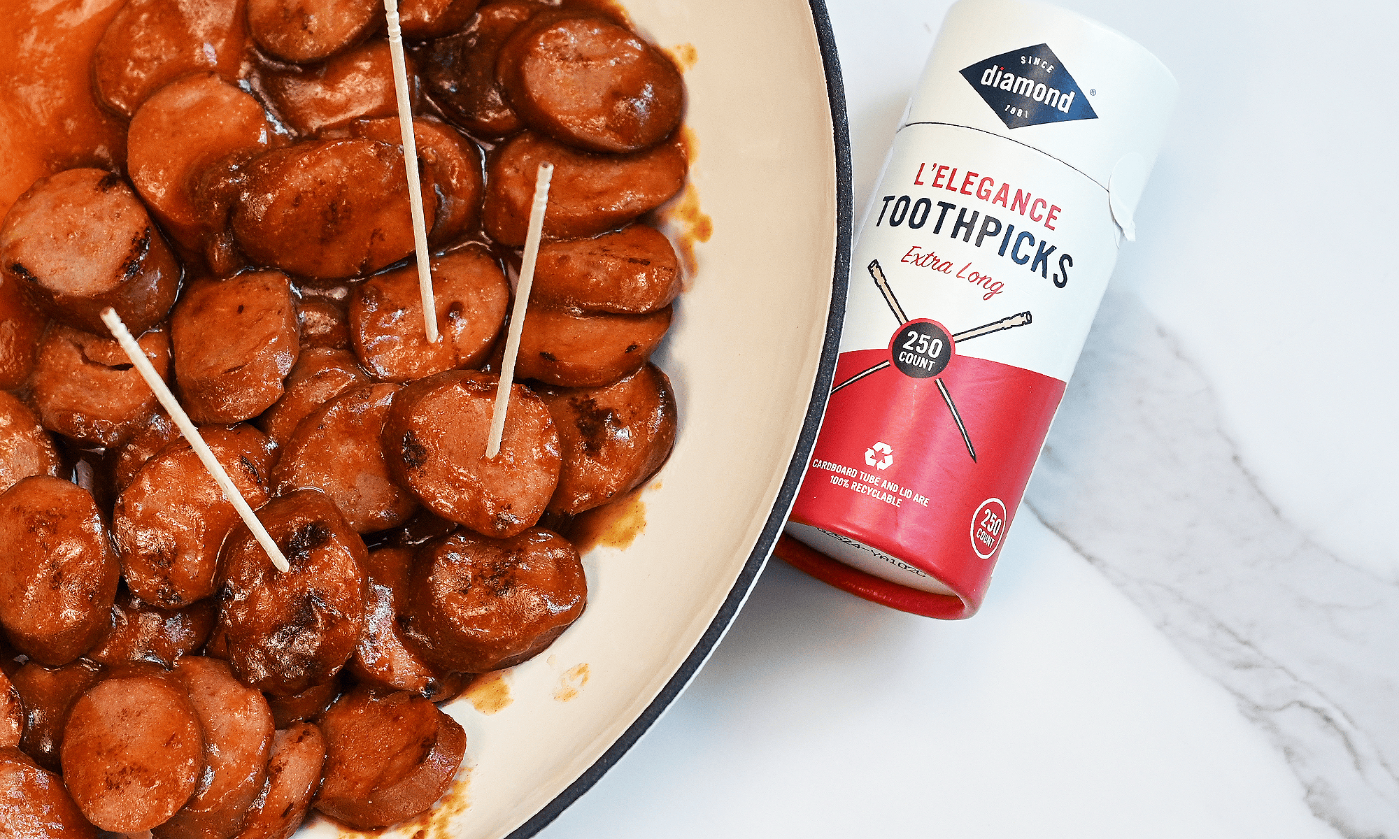 BBQ Sausage Bites sliced and ready to serve with toothpicks. showing toothpick container round up