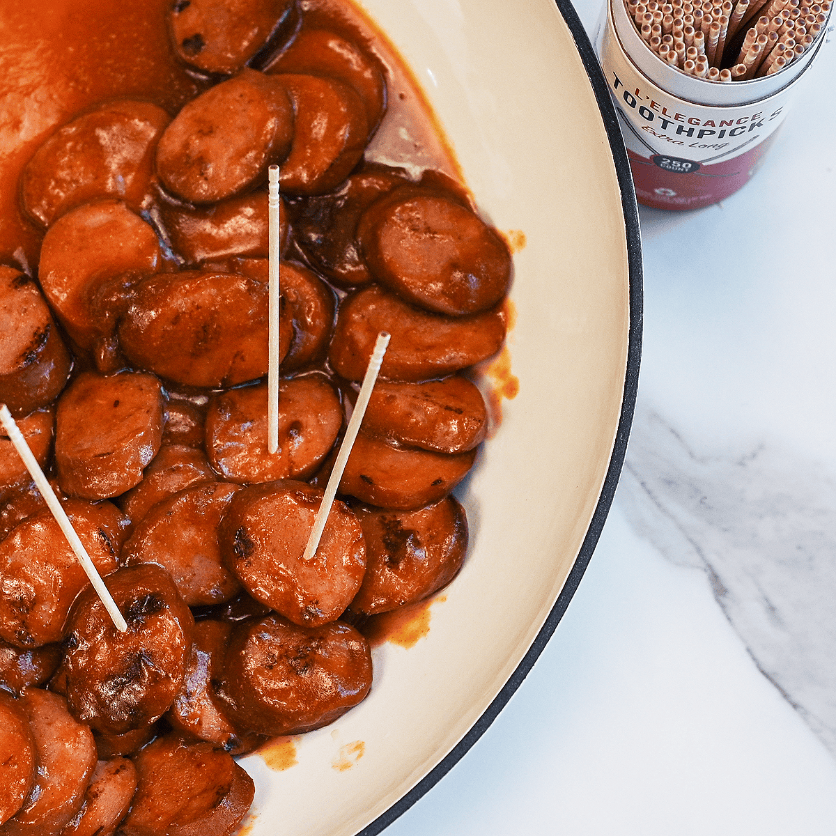 BBQ Sausage Bites sliced and ready to serve with toothpicks.