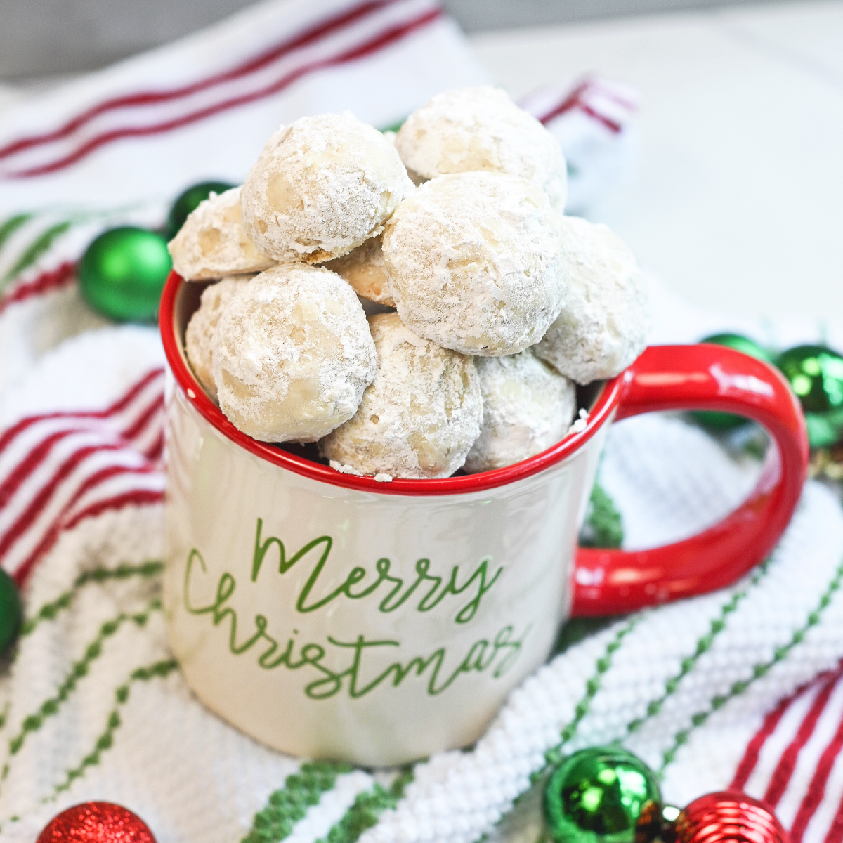 Snowball Cookies sitting gin festive Christmas mug